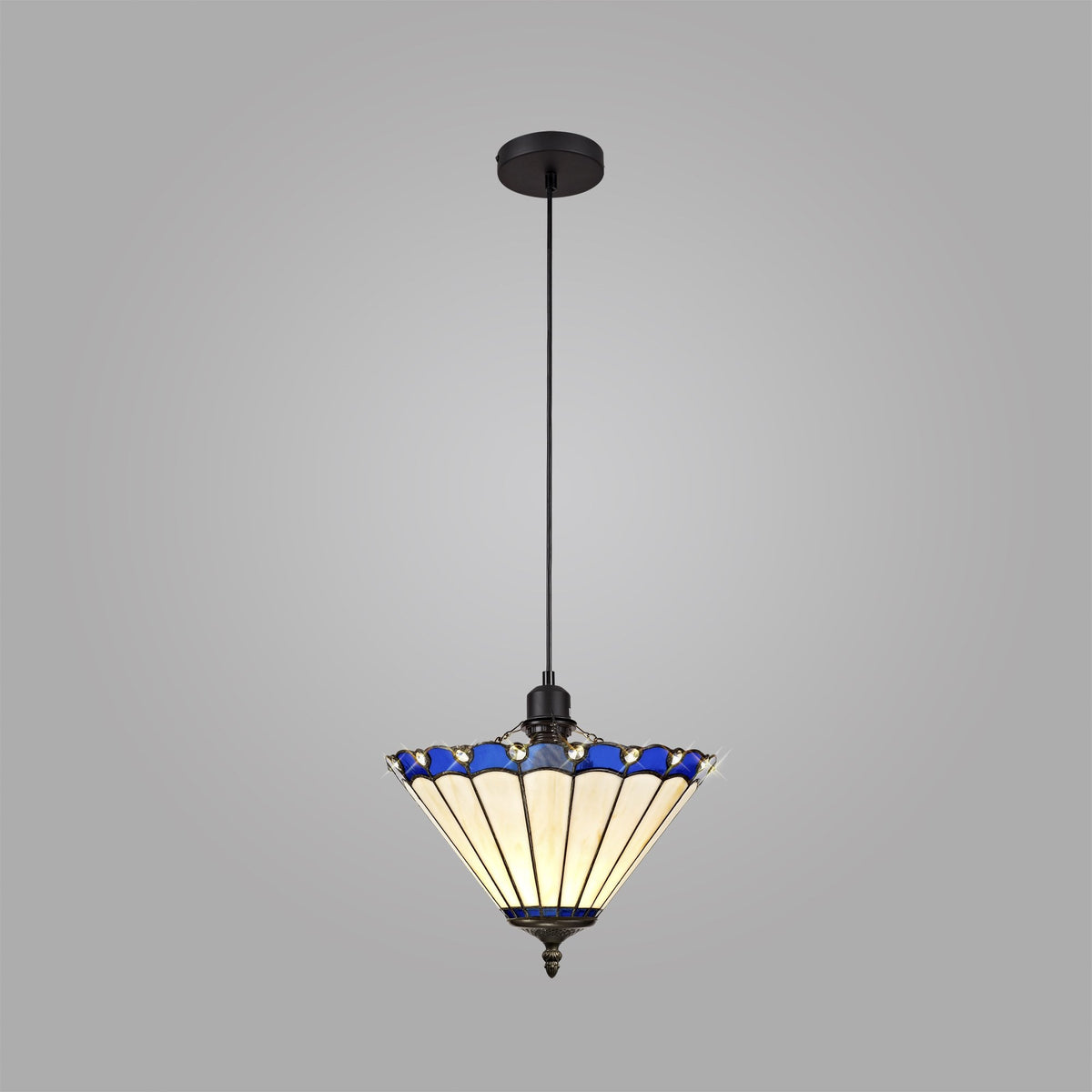 A pendant light with a white and blue stained glass shade against a grey background.