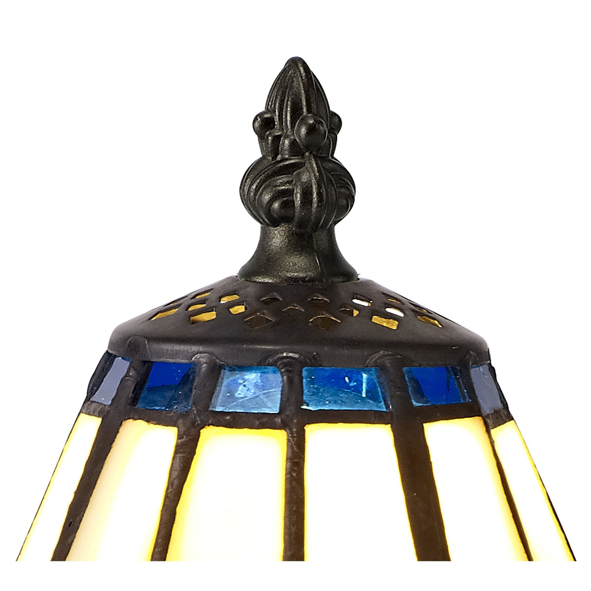 A close-up of the top finial and blue glass details of the Tiffany style lamp.
