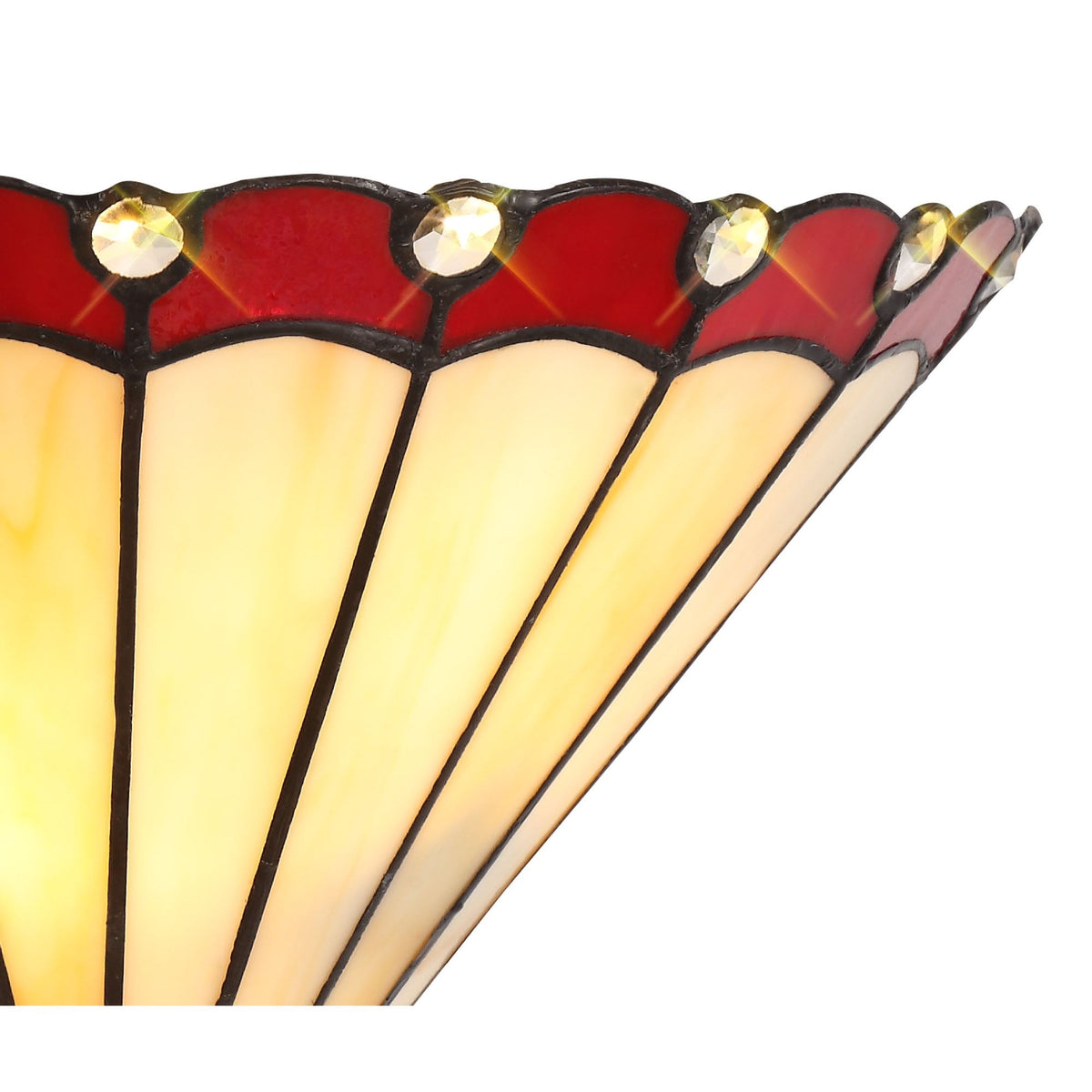 A close-up of the red and white stained glass wall light from the side.