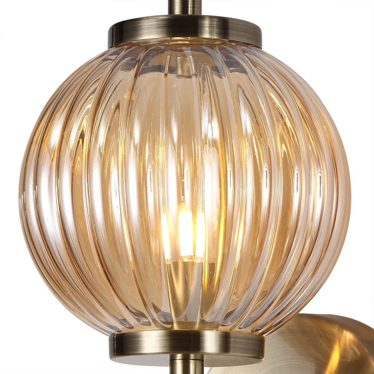 Fiddleford Wall Lamp in Antique Brass and Amber Glass