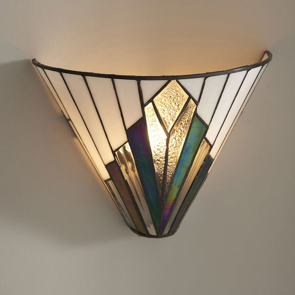 Art Deco wall light in a white and iridescent glass design, casting light upwards.