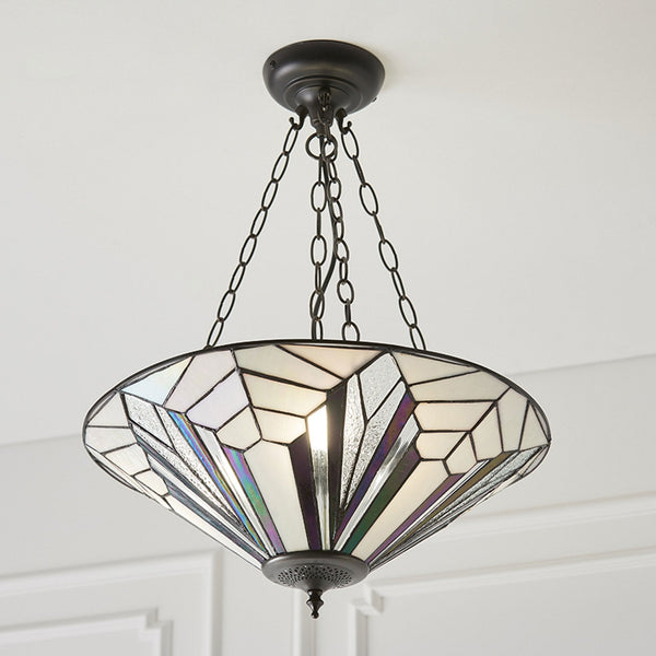 A decorative ceiling light fitting with a white and purple patterned shade and metal chains.