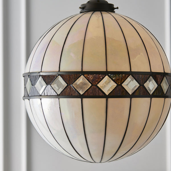 A close-up of the elegant stained glass globe pendant light, highlighting its intricate details.