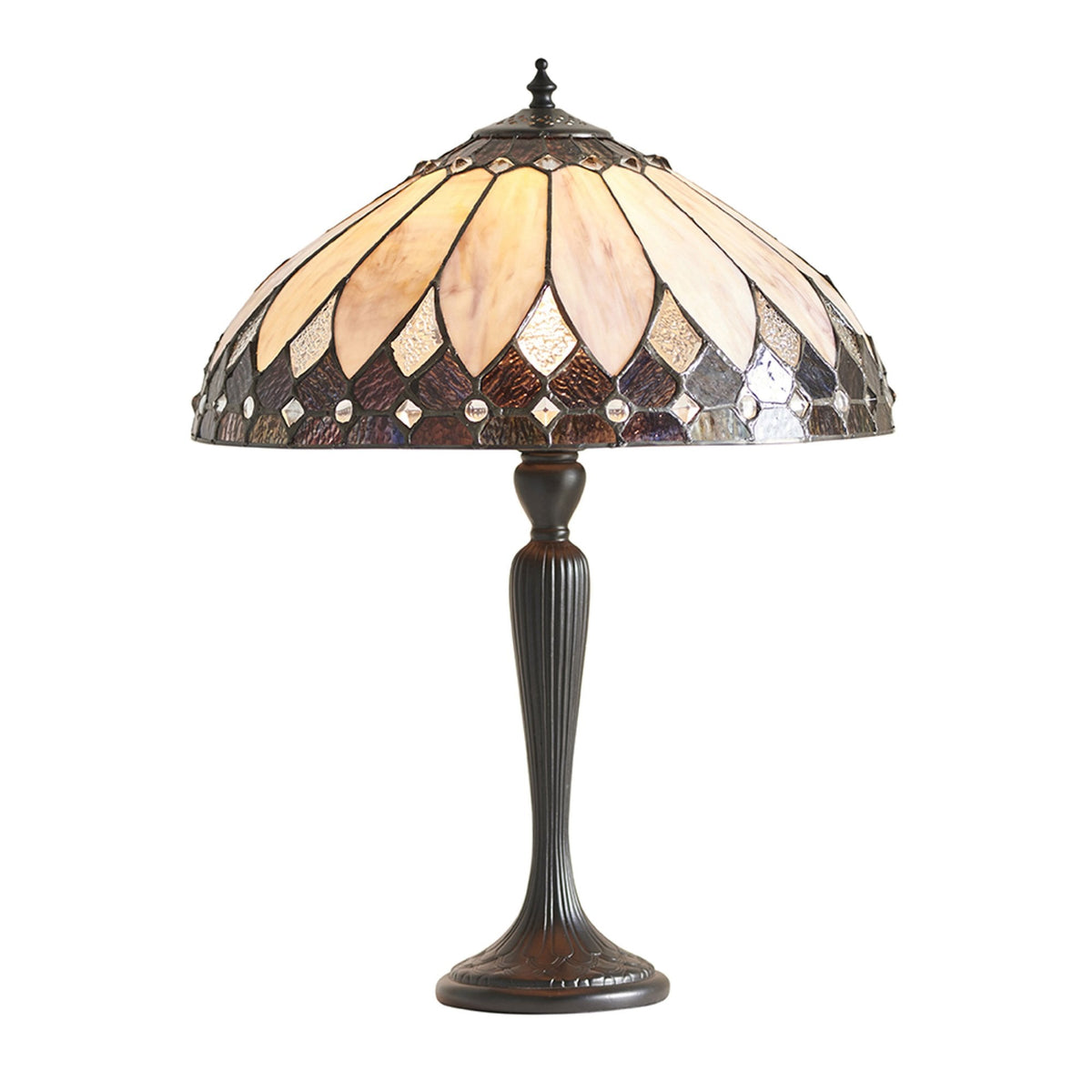 An ornate table lamp with a patterned glass shade on a plain white background.