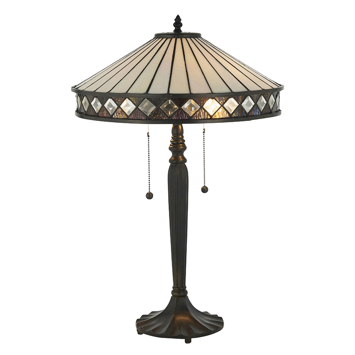 The table lamp, featuring a white patterned shade and a dark, ornate base.