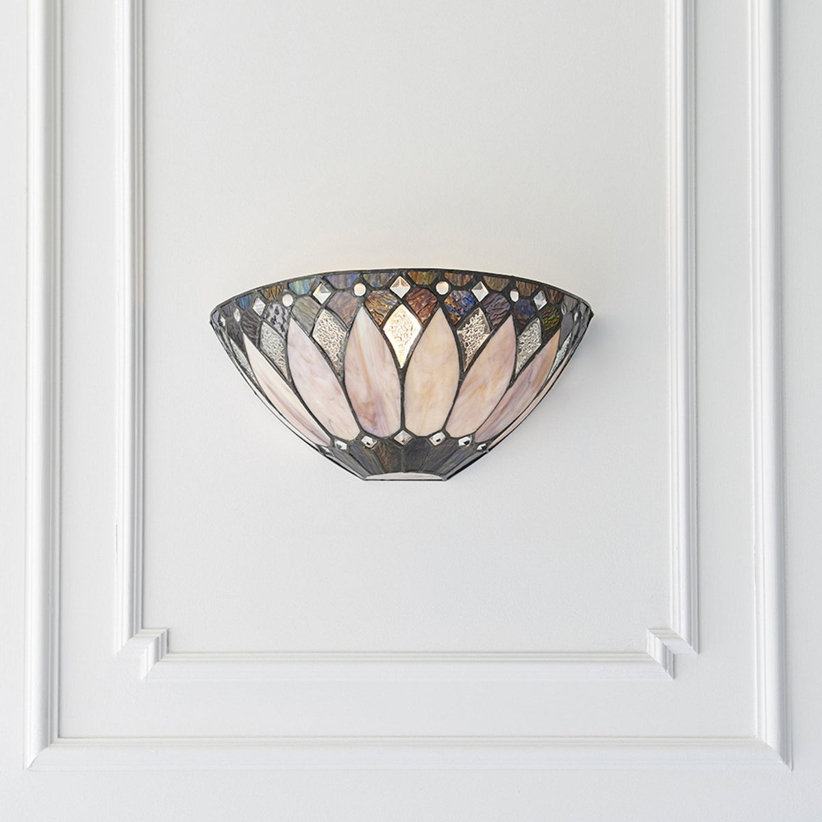 The Tiffany lotus flower pink and purple glass wall light, unlit on a white wall.