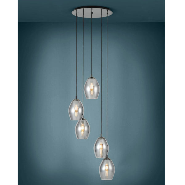 A contemporary cluster pendant light with five clear glass shades hanging at different heights.