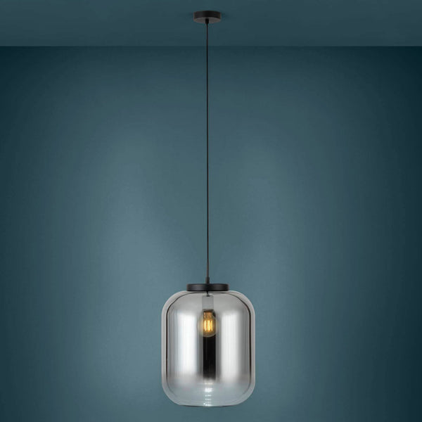 A black pendant light with a smoked glass shade on a dark blue background.