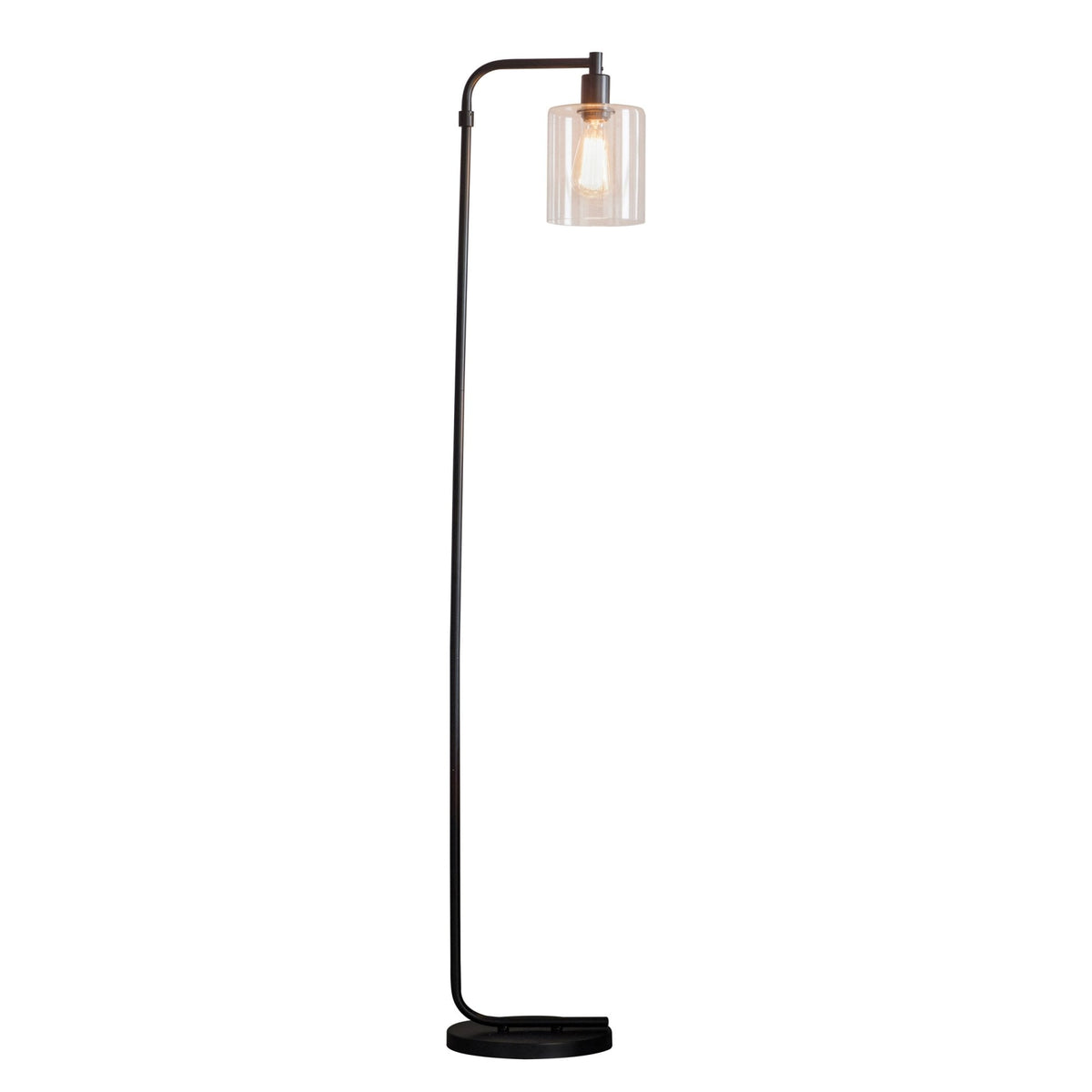Tall black metal floor lamp with a curved arm, clear glass cylindrical shade, and an exposed bulb on a white background.