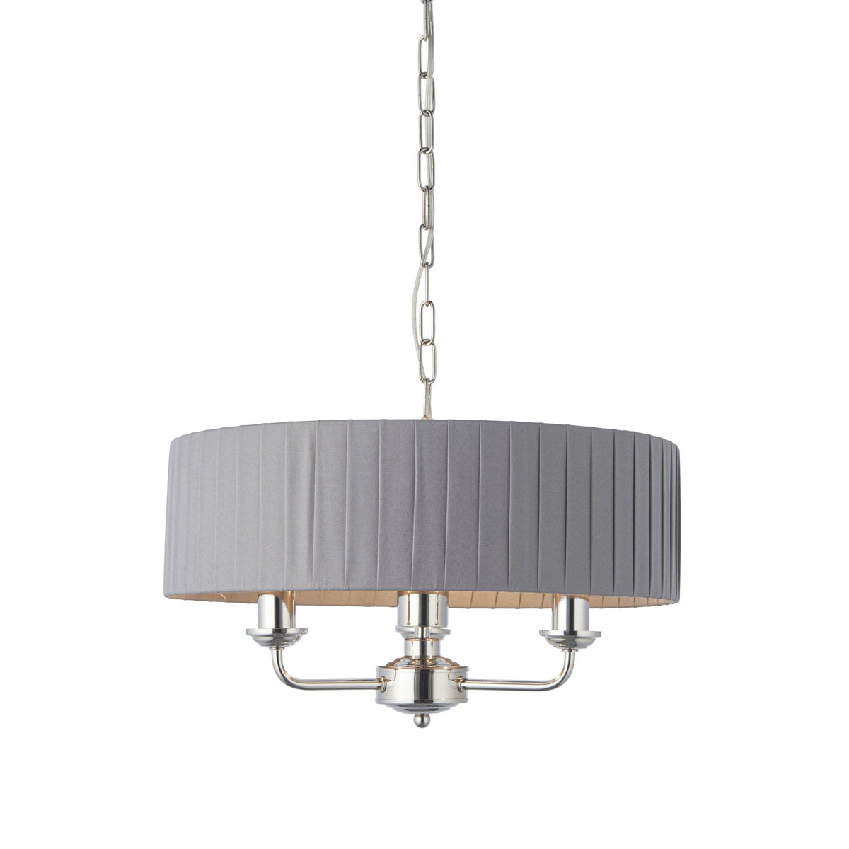 A grey pleated drum shade chandelier with three exposed bulbs hangs from a chain against a white background.