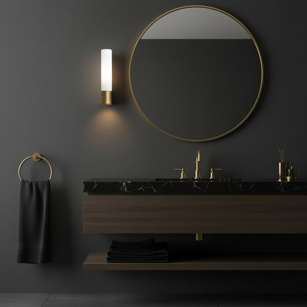 Bathroom with dark walls, gold fixtures, black marble counter, and dark wood vanity