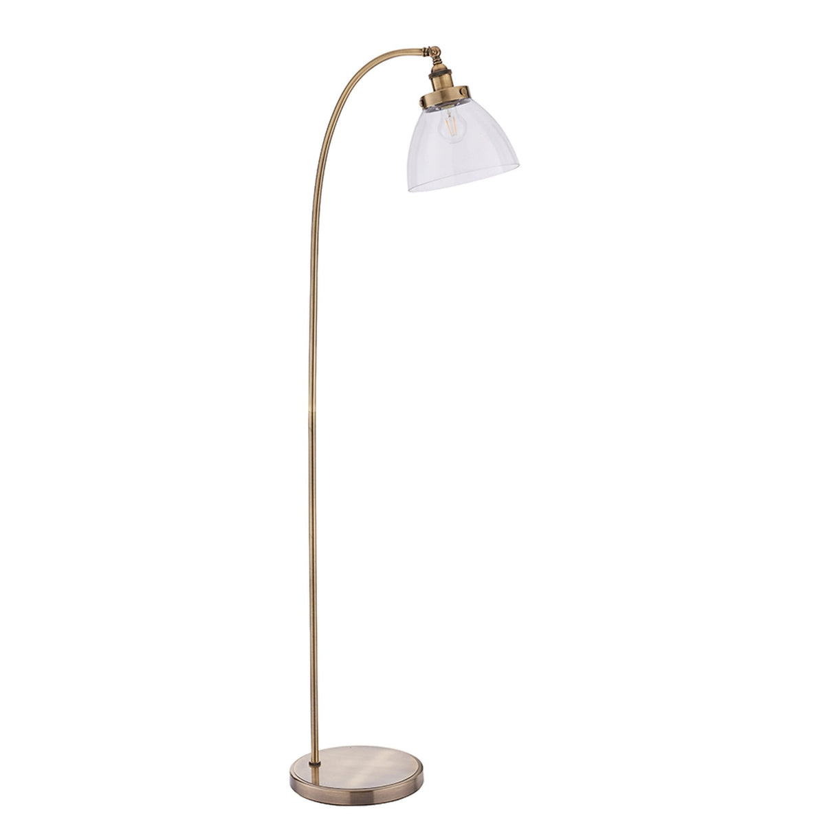 Antique brass floor lamp with a curved arm and a clear, fluted glass shade, standing on a white background.