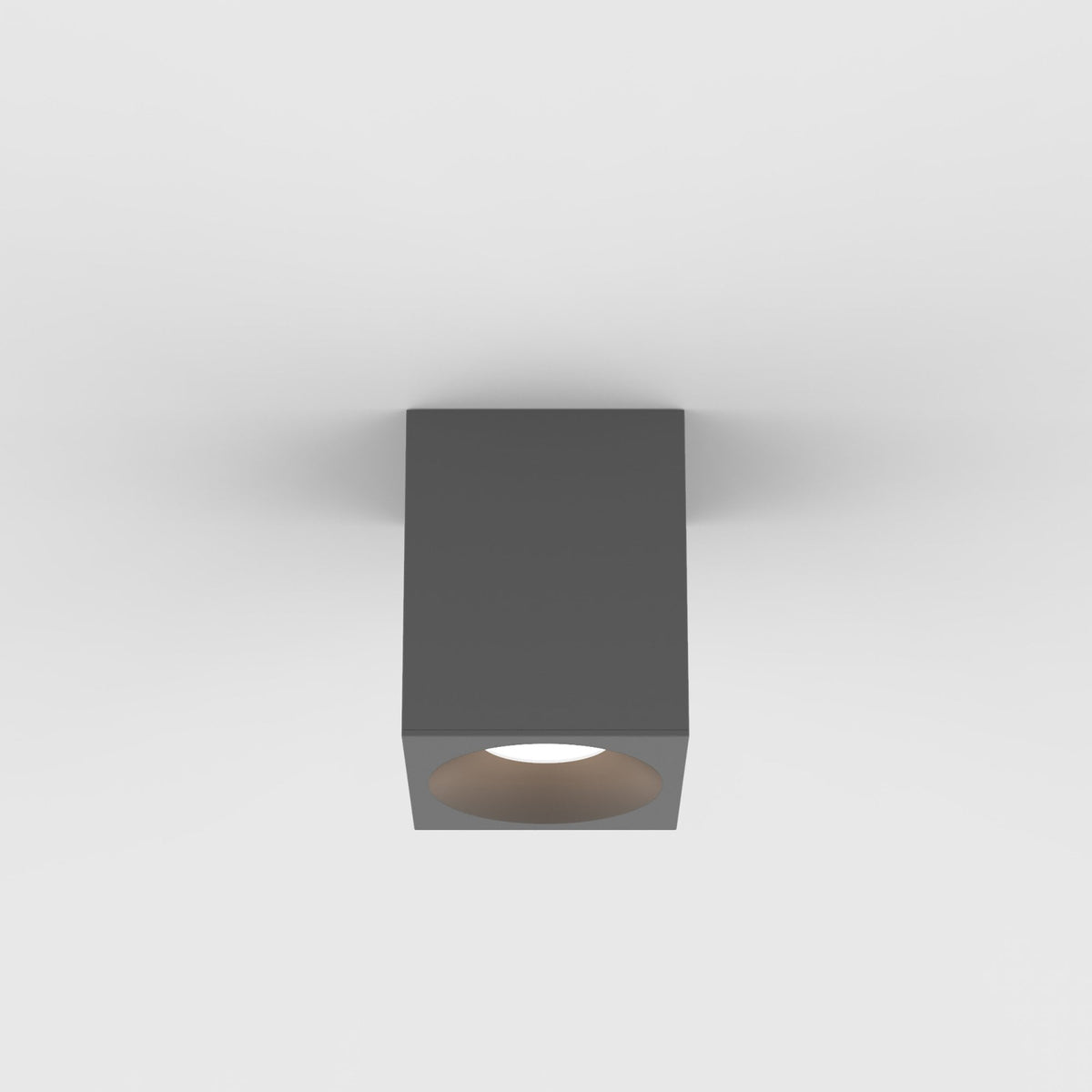 Square dark grey ceiling light with a round, illuminated opening