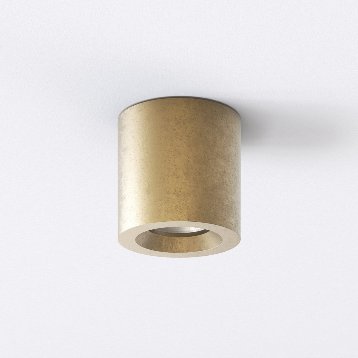 Cylindrical brass ceiling light with a textured finish