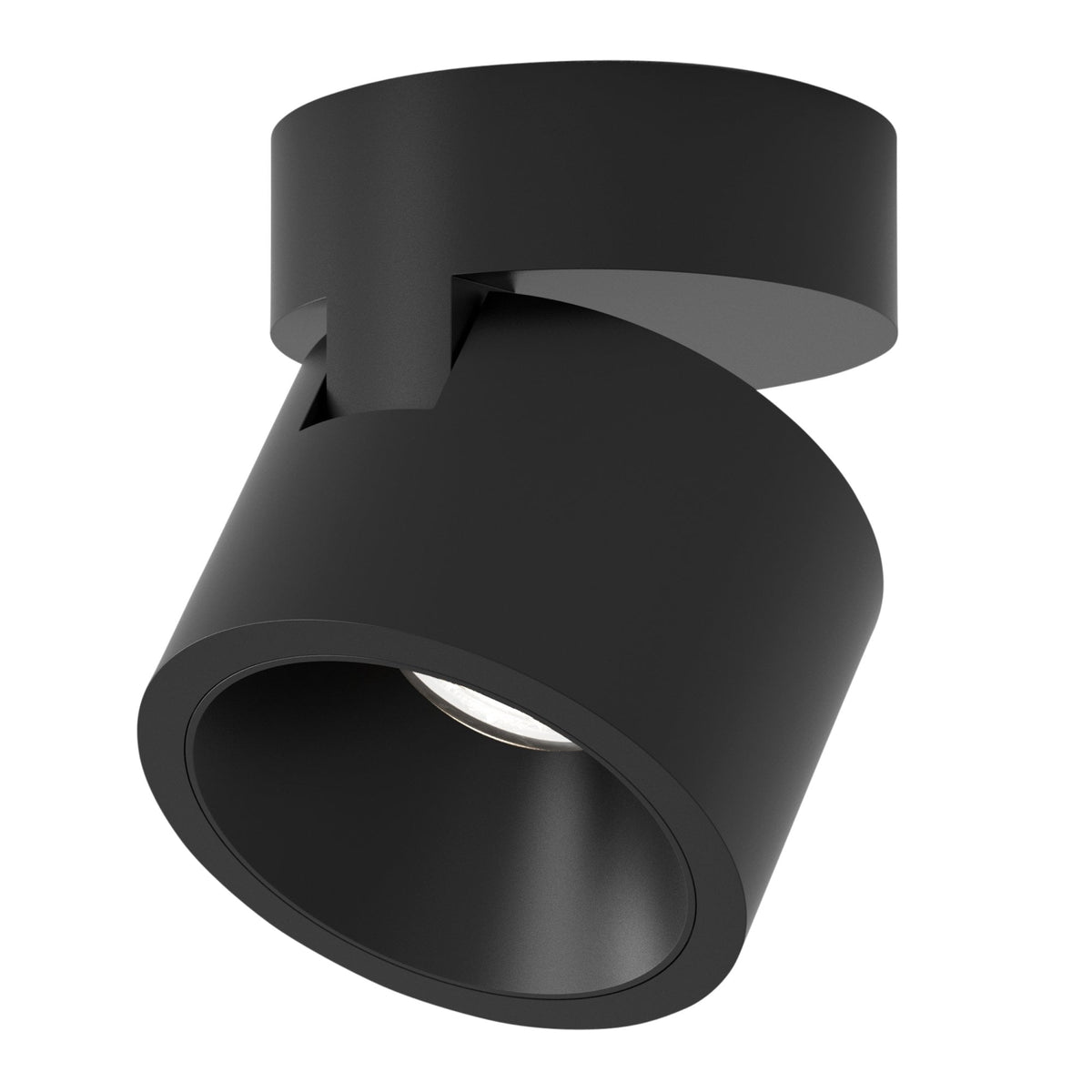 Black cylindrical ceiling light with an adjustable head, angled downwards, showing a small light source inside