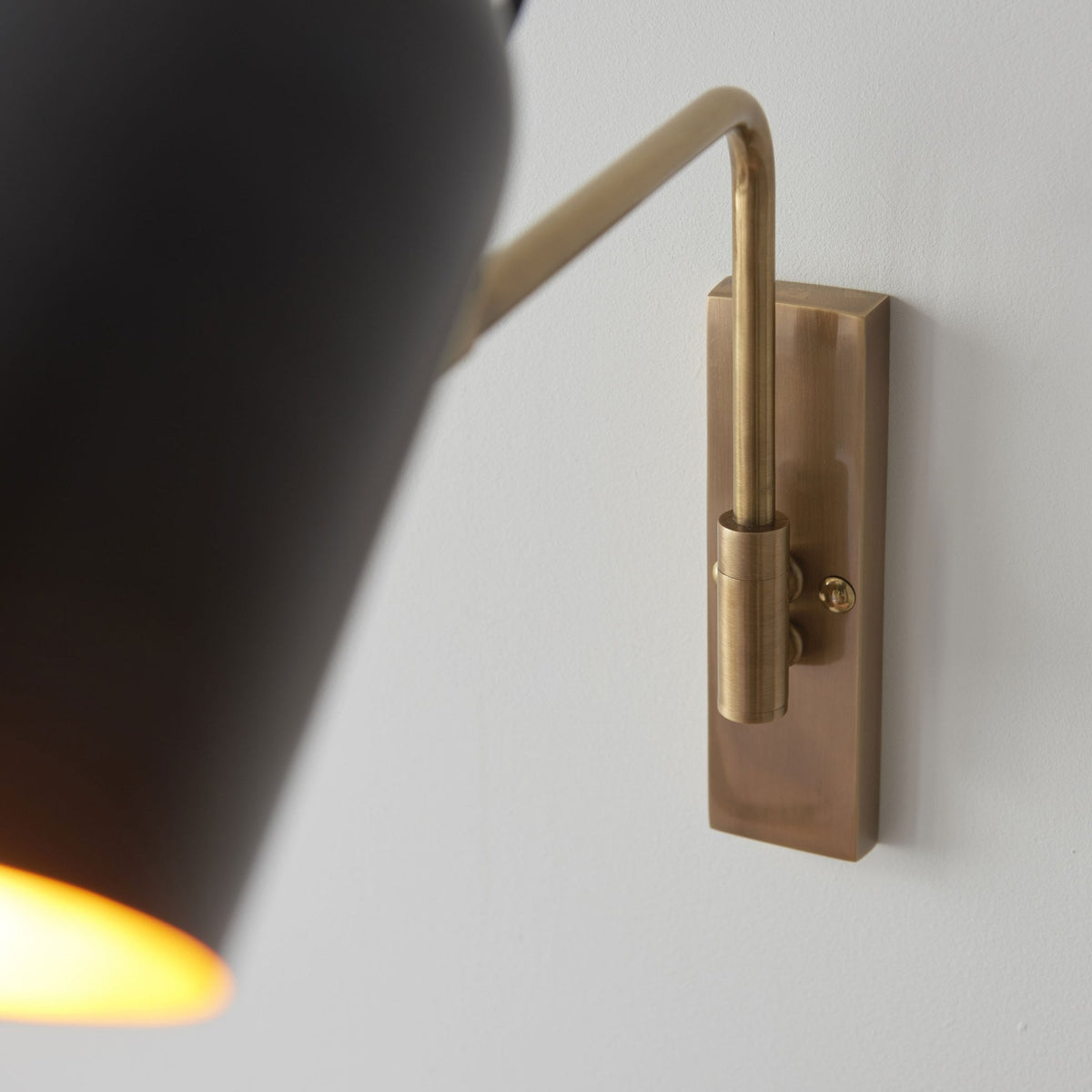 Navren Swing Arm Wall Light in Antique Solid Brass & Matt Black