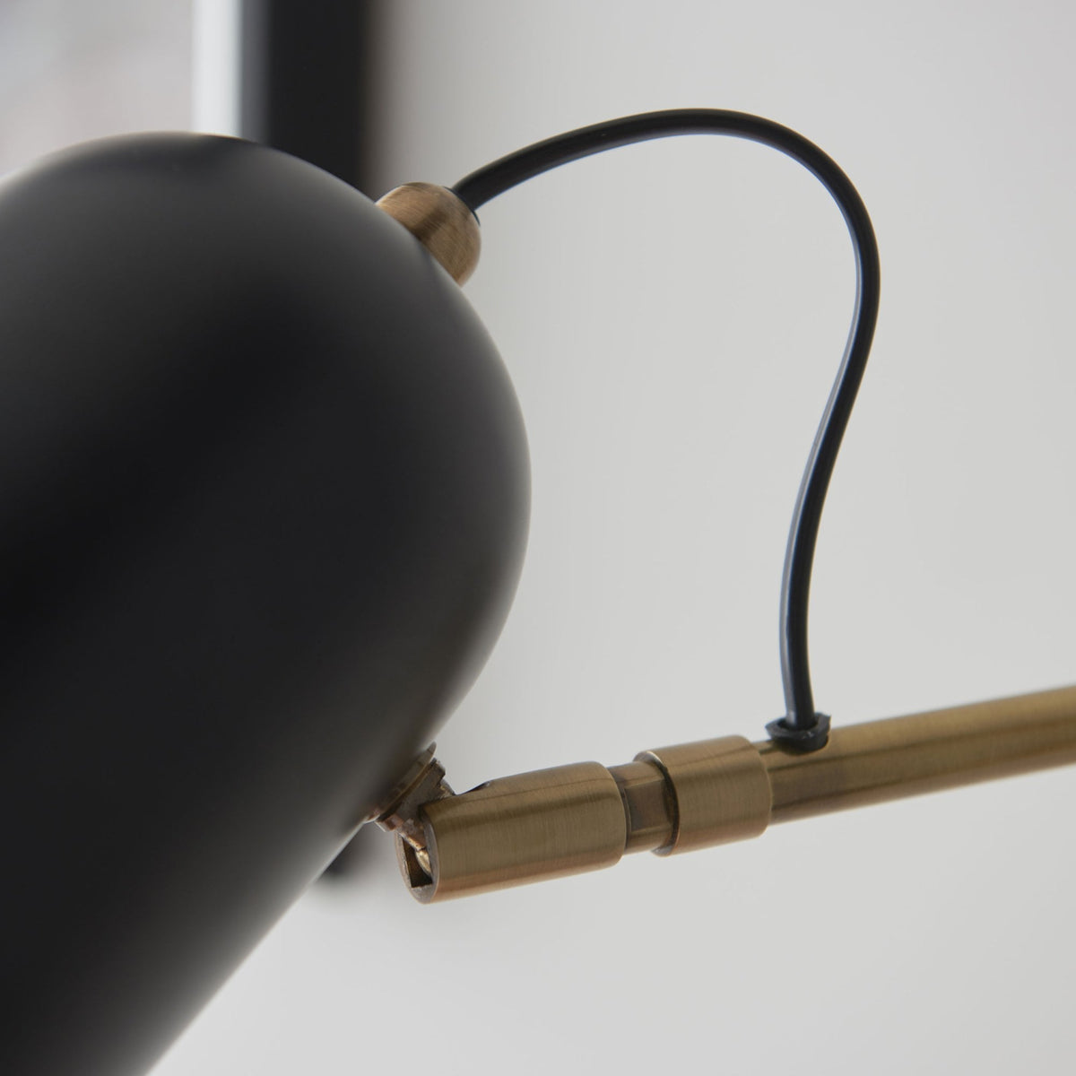 Navren Swing Arm Wall Light in Antique Solid Brass & Matt Black