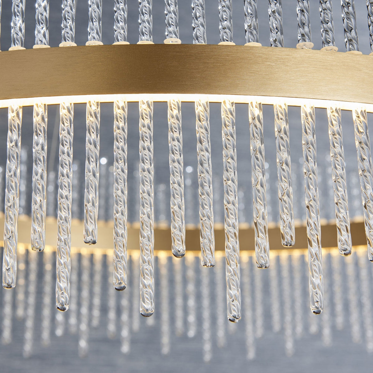 Close-up of the LED chandelier's crystal rods, highlighting the clear detail of each rod. A luxurious design element.