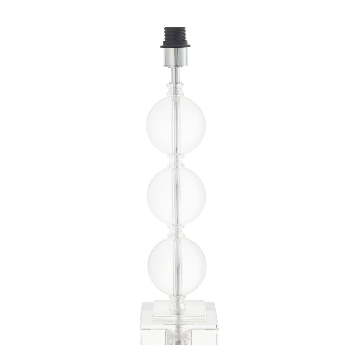 A clear glass table lamp base with three stacked spheres and a square foot, without a shade, on a white background.