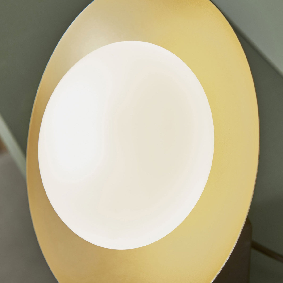 Close-up of the disc light source of a modern table lamp.