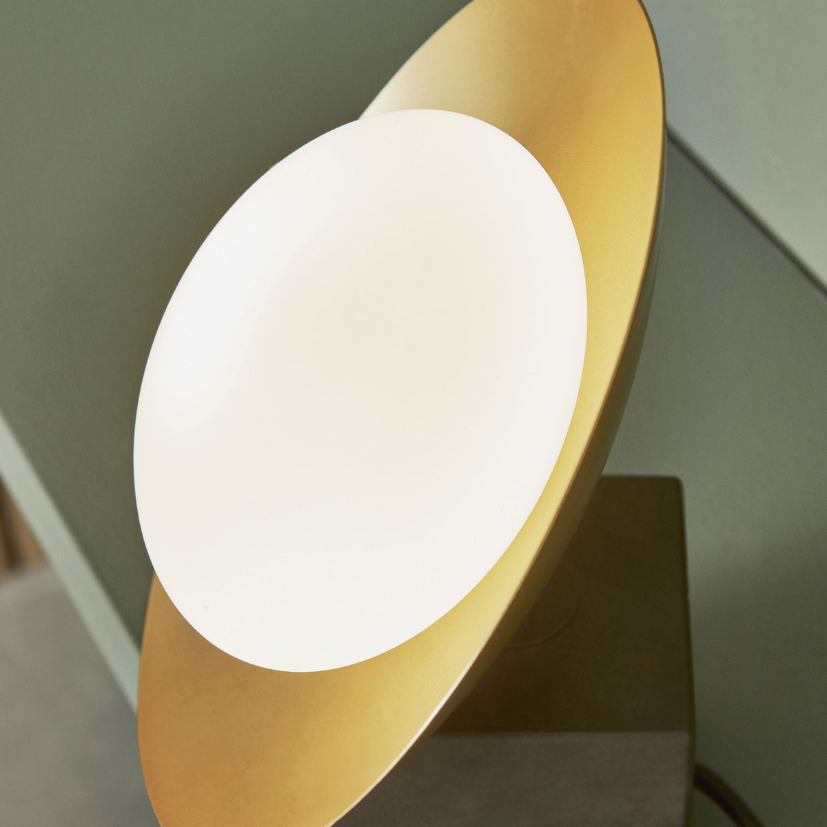 Close-up of the disc light source of a modern table lamp.