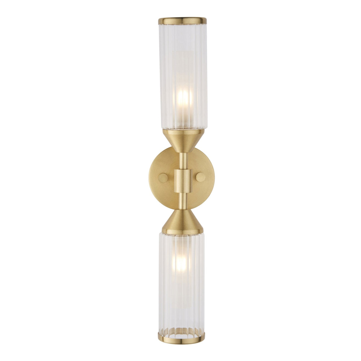An illuminated brass wall light with two clear, fluted glass shades on a white background.