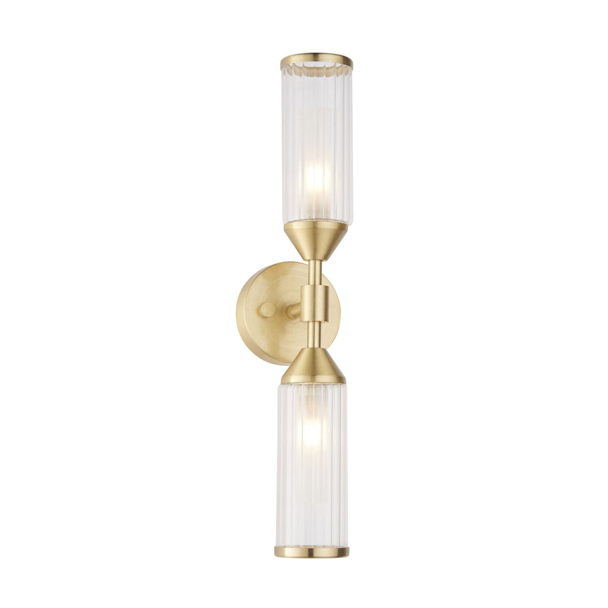 An illuminated brass wall light with two clear, fluted glass shades on a white background.