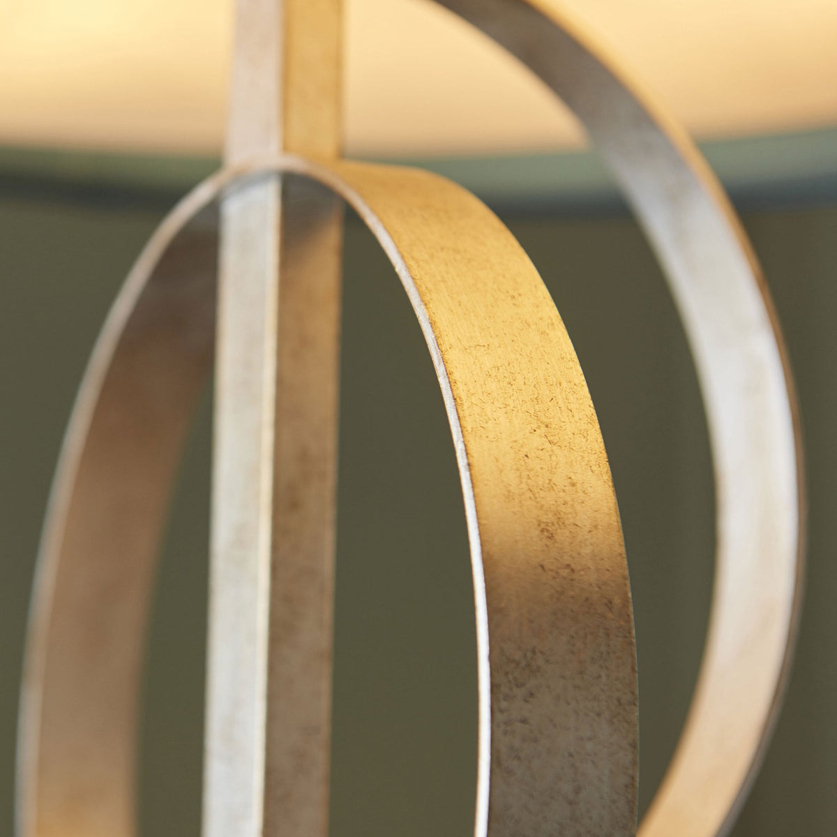 An extreme close-up of the silver orbit detail, emphasizing its texture and craftsmanship.