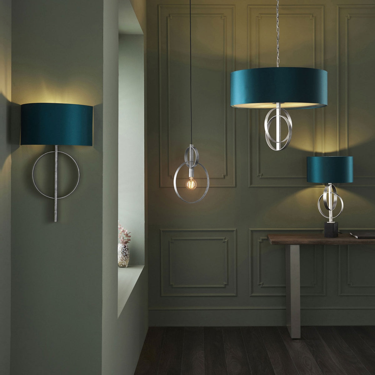 A collection of lighting fixtures, including a pendant, wall sconce, and table lamp, in a coordinated style.