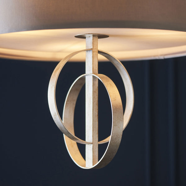 Close-up of the champagne gold intertwined metallic rings on the pendant light.