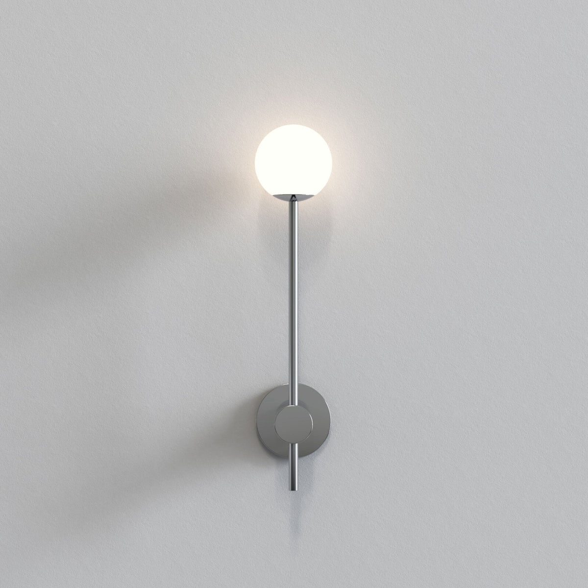 Sleek wall-mounted light fixture with a spherical white globe and a brushed metal finish