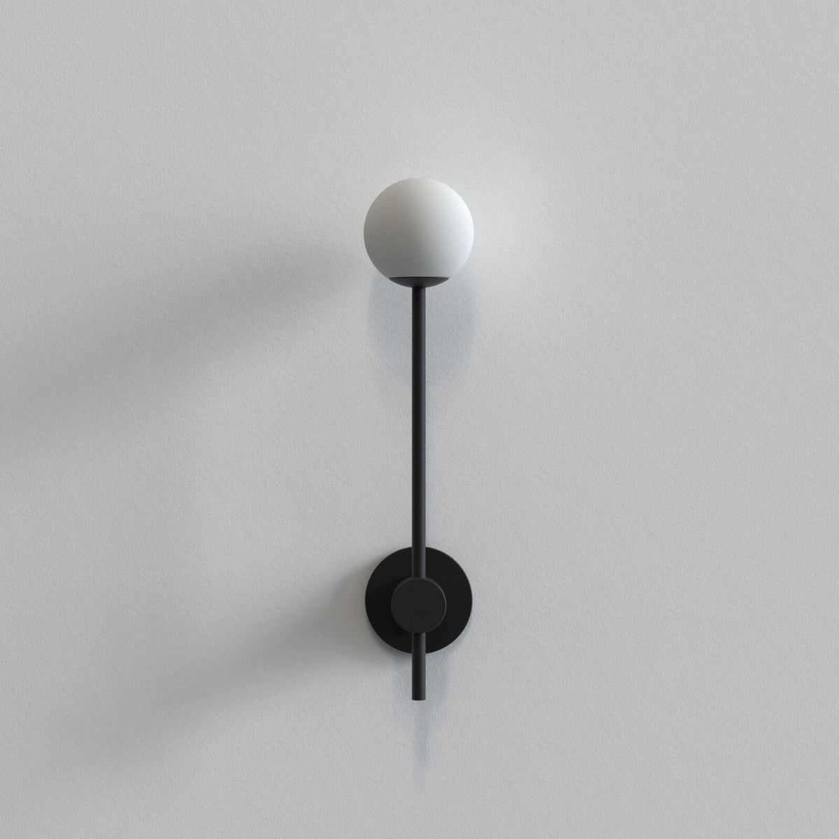 Black wall lamp with a white spherical light source