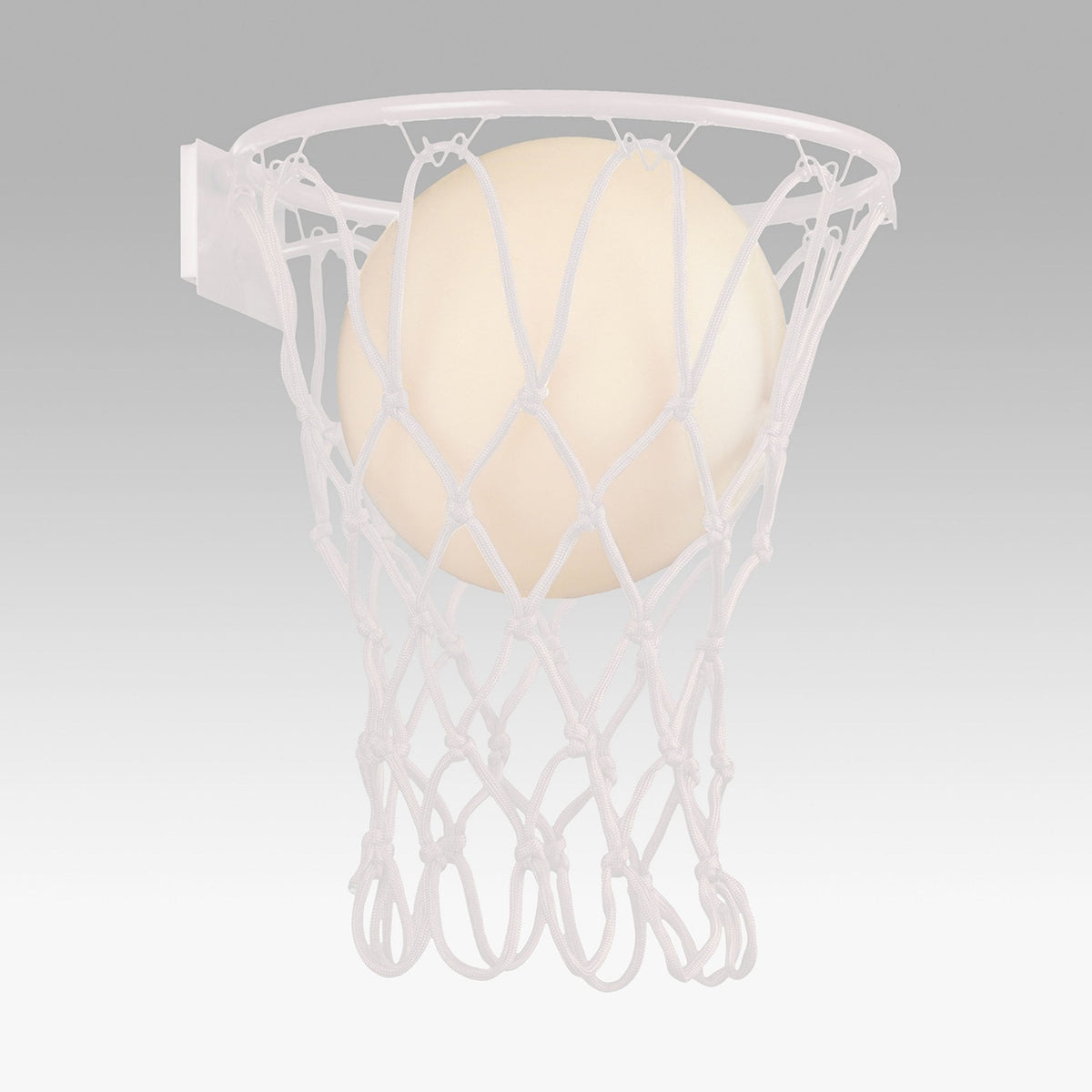 Basketball hoop and a basketball entering the net for a score.