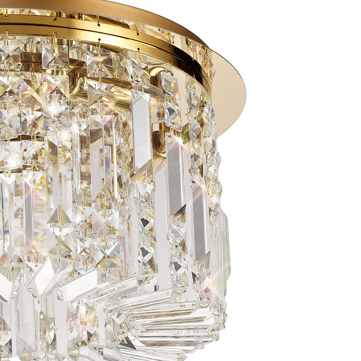 Angled view of the brass and crystal ceiling light from the right side.