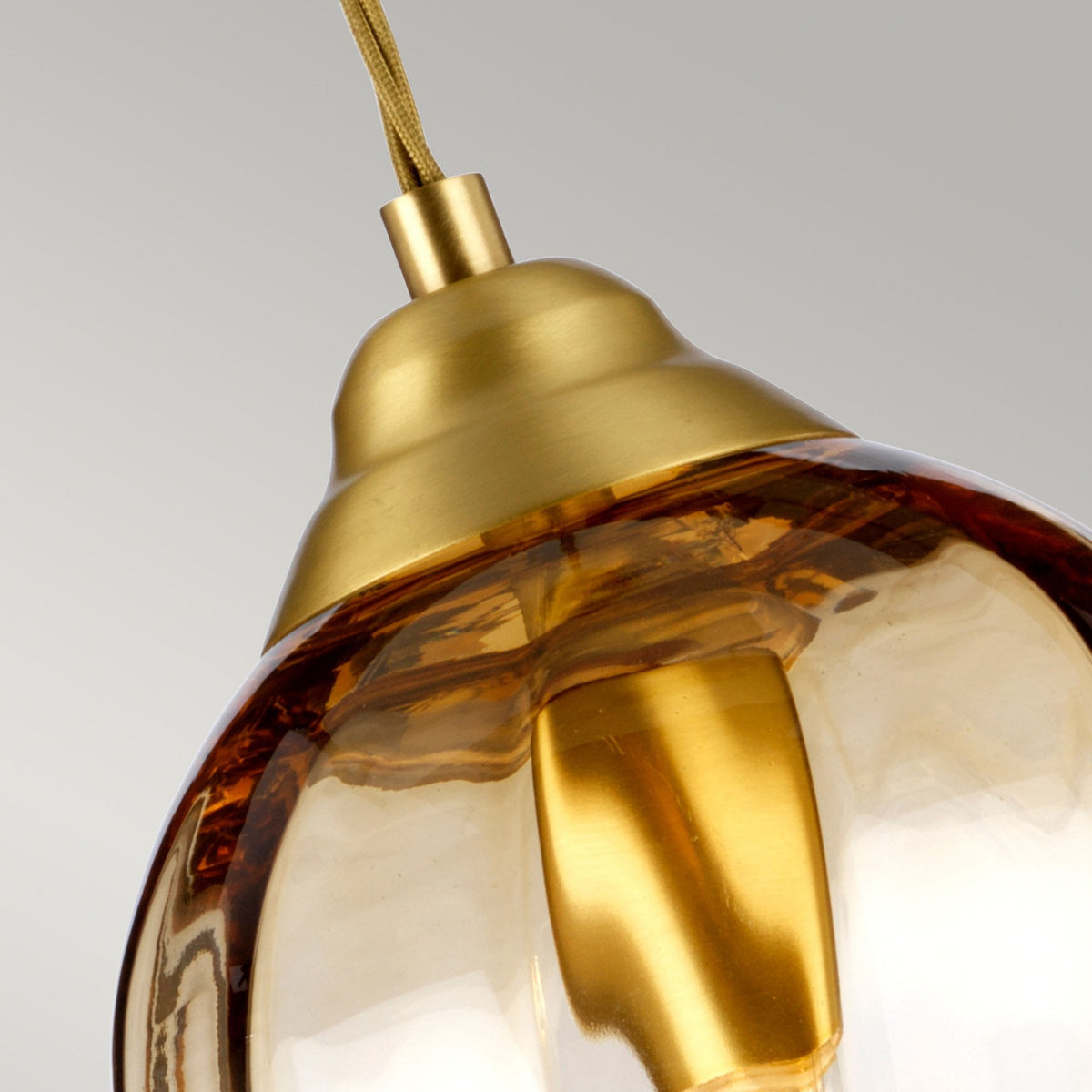 Tiber Single Pendant in Brushed Brass with Amber Glass