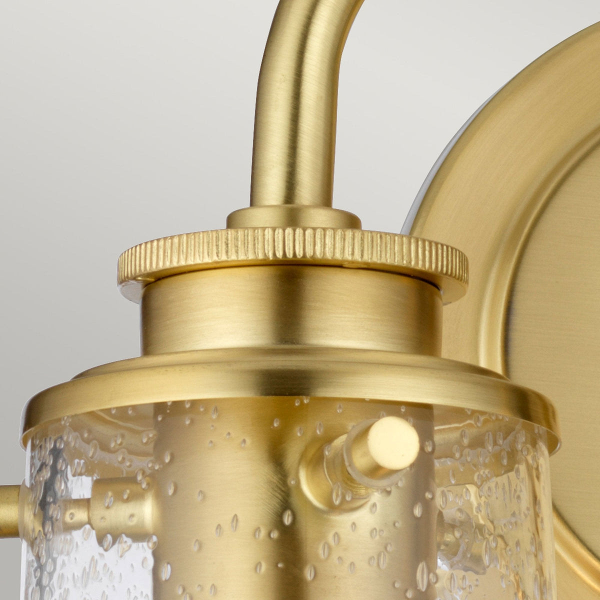Braelyn Two Arm IP44 Wall Light in Brushed Brass & Seedy Glass