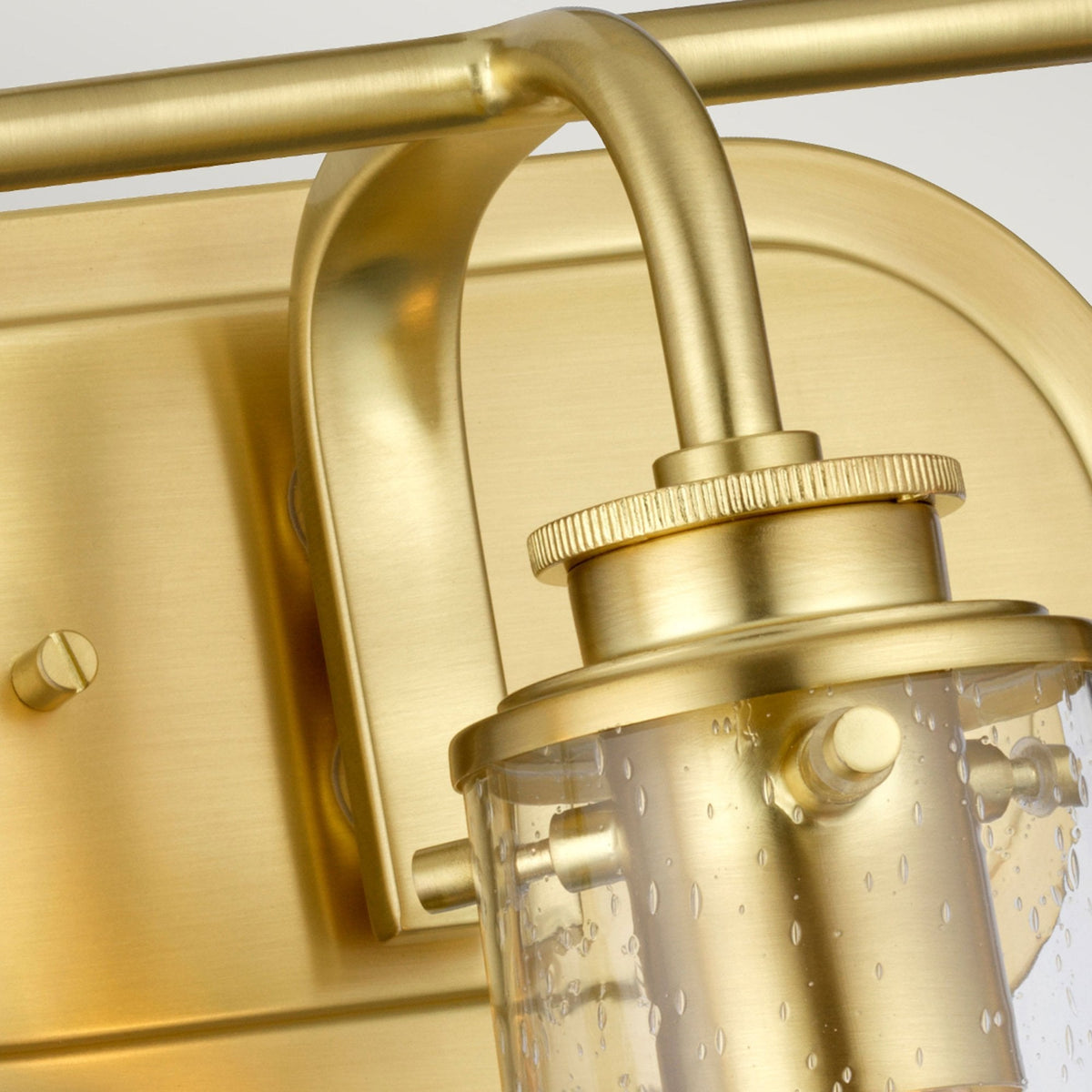 Braelyn Three Arm IP44 Wall Light in Brushed Brass & Seedy Glass