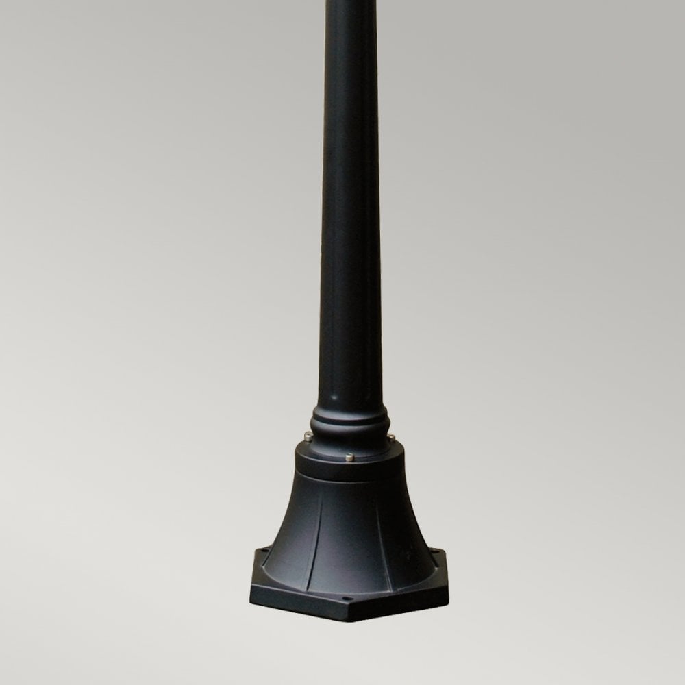 The sturdy, decorative base of a black street lamp, ensuring stability and classic appeal.
