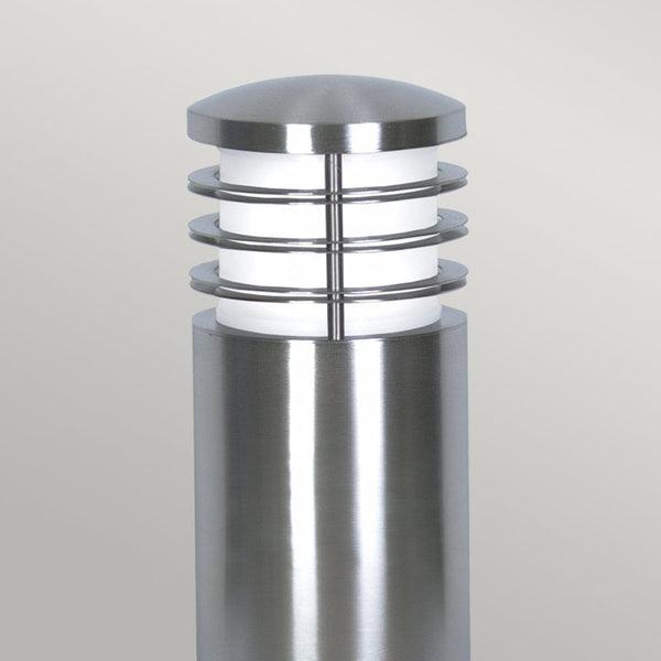 Top half of a modern silver stainless steel outdoor bollard light with a ribbed design.