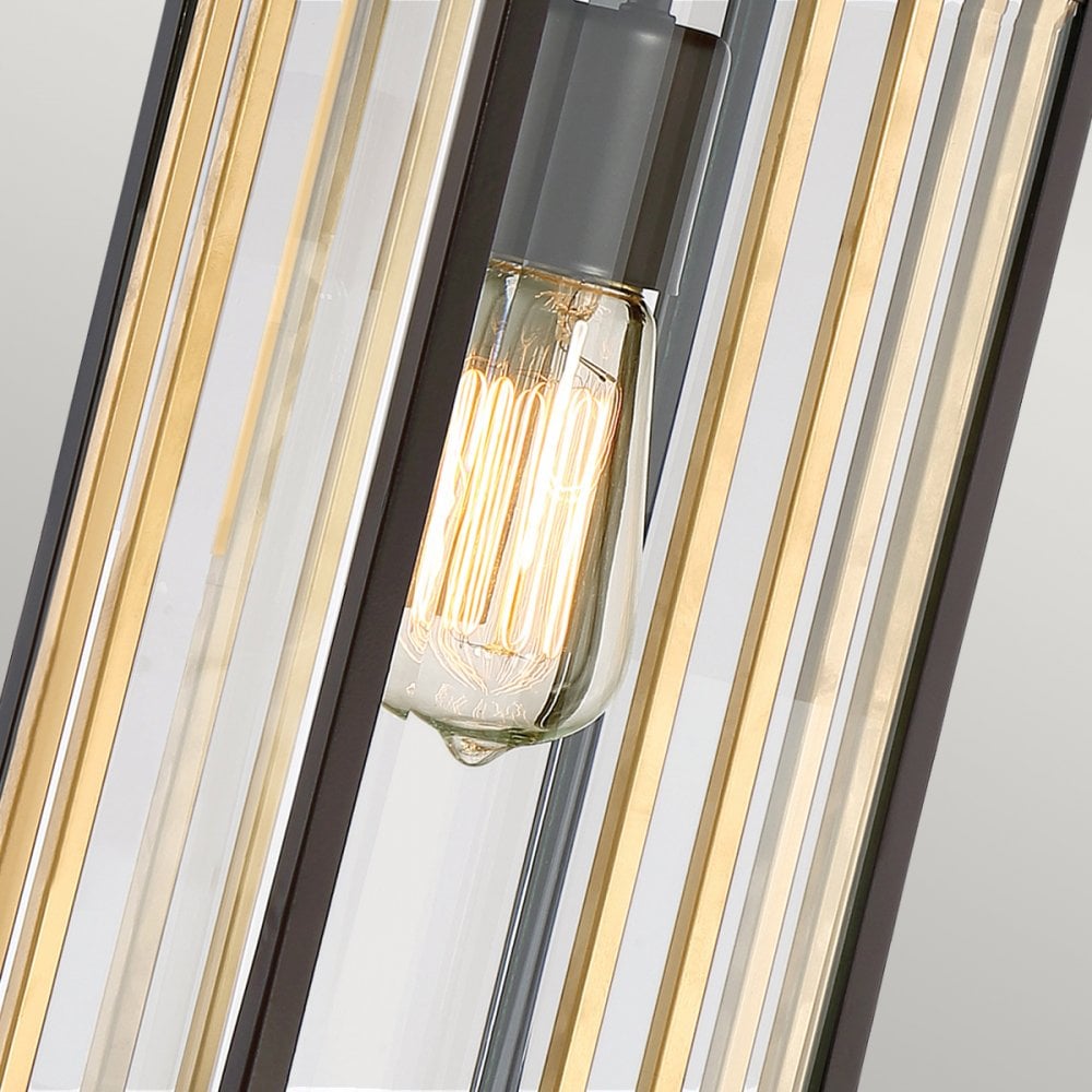 Close-up of the light fixture showing the vintage-style bulb and brass accents.