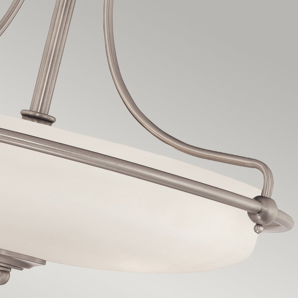 A detailed view of the frosted glass shade and the decorative metal frame of the light.