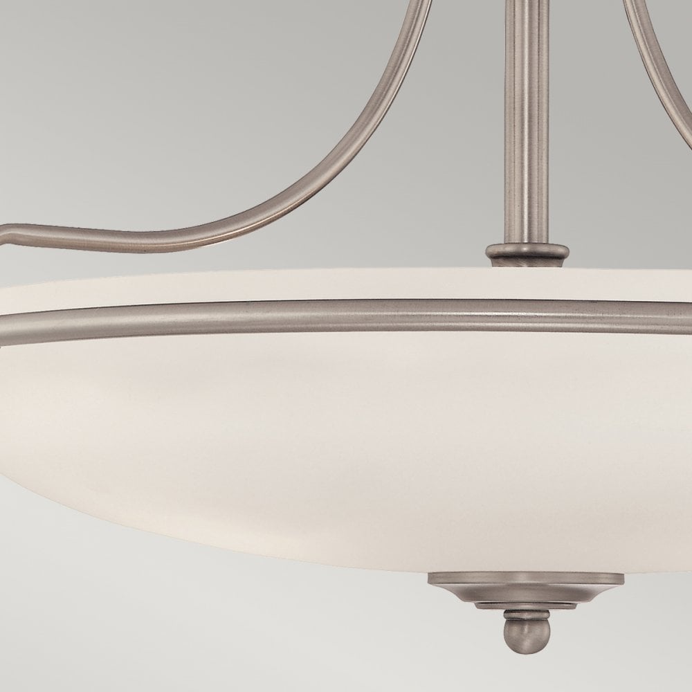 A close-up of the bottom of the semi-flush light, showing the decorative finial.