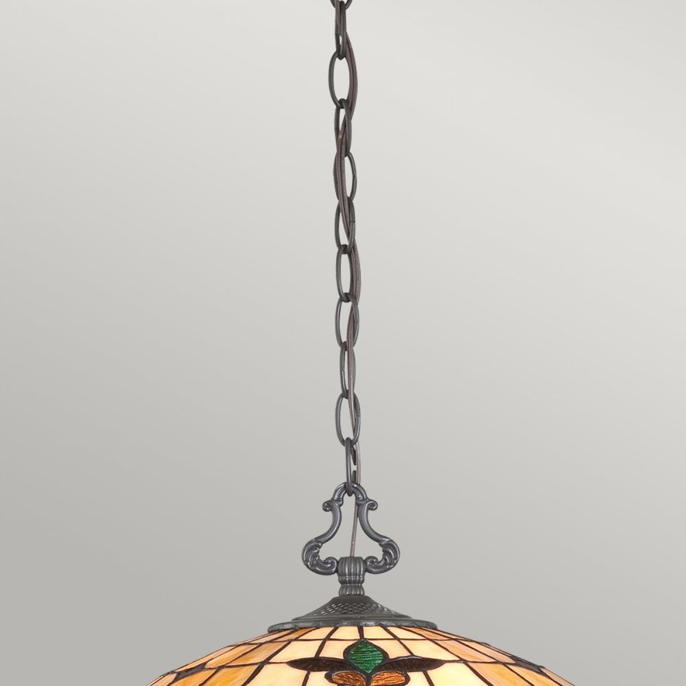 Close-up of the metal chain and decorative hook connecting to the stained-glass ceiling light.