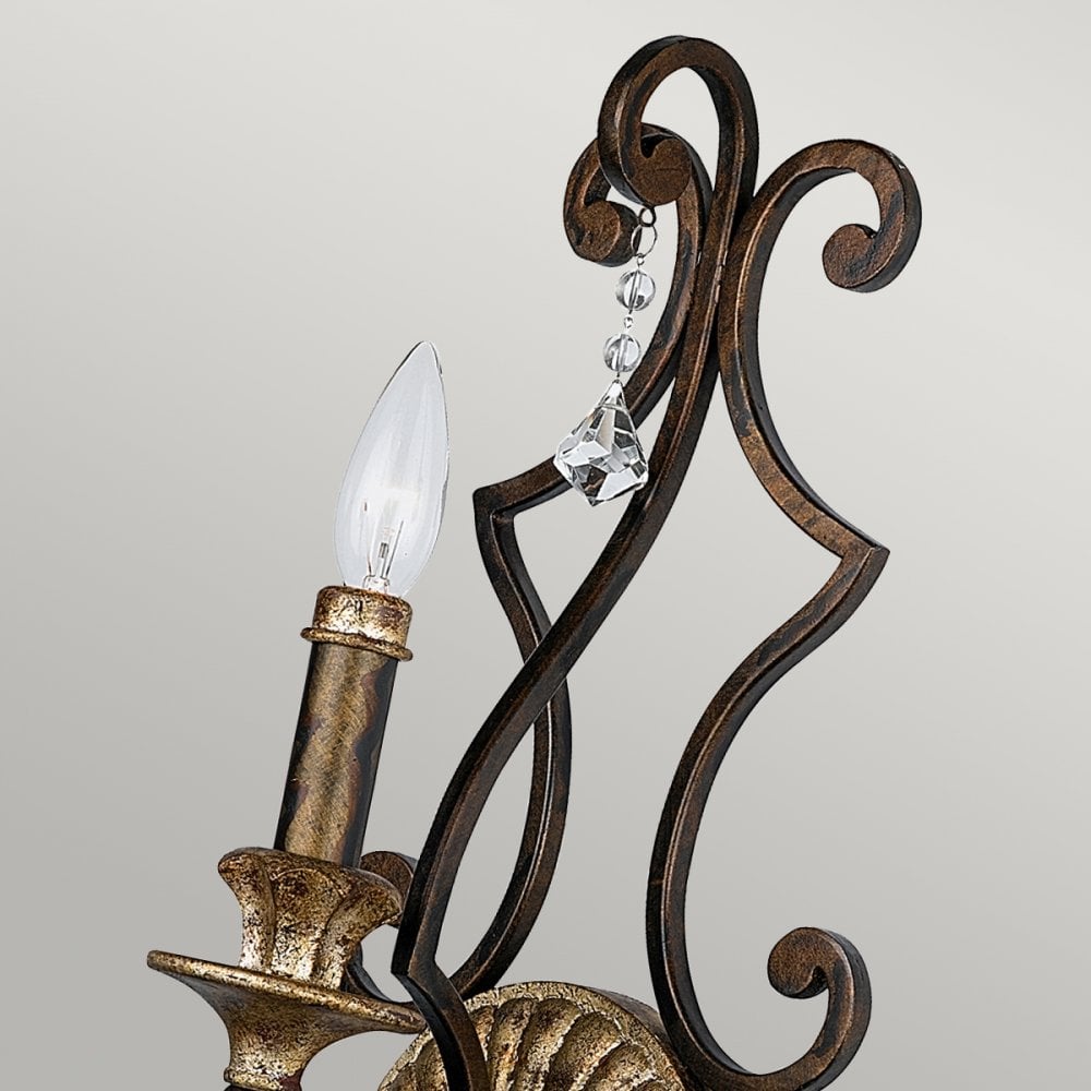 Close-up of the vintage-style wall sconce, highlighting the candle-like bulb and crystal.