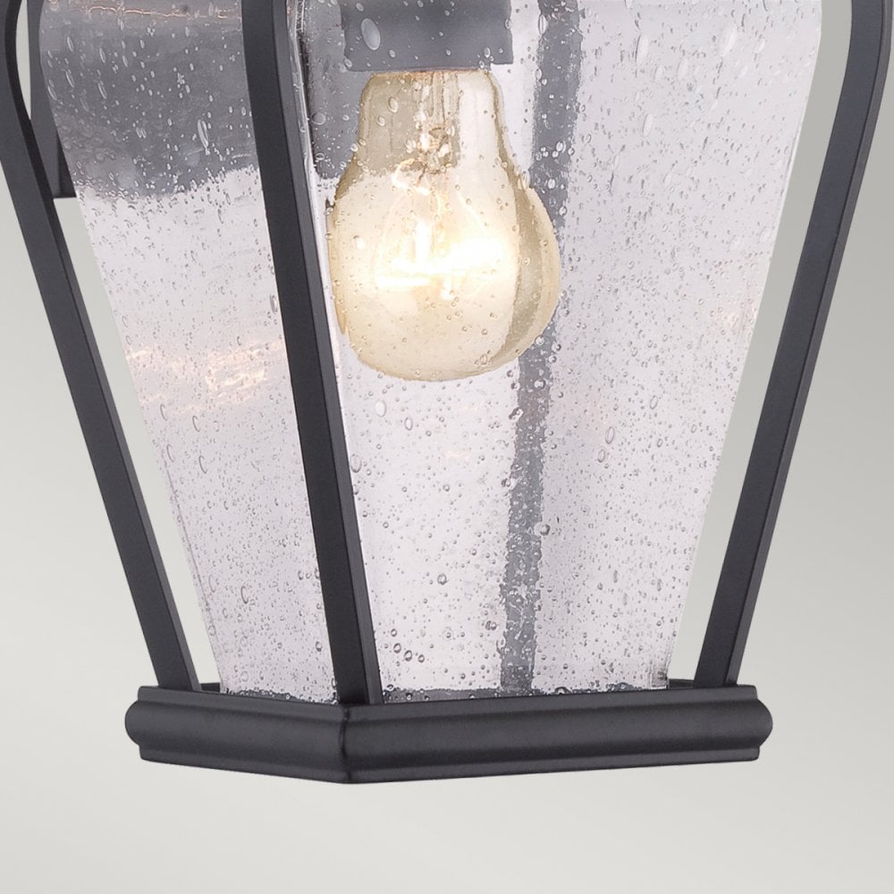 Bottom section of the outdoor wall light showing the textured glass and bulb.