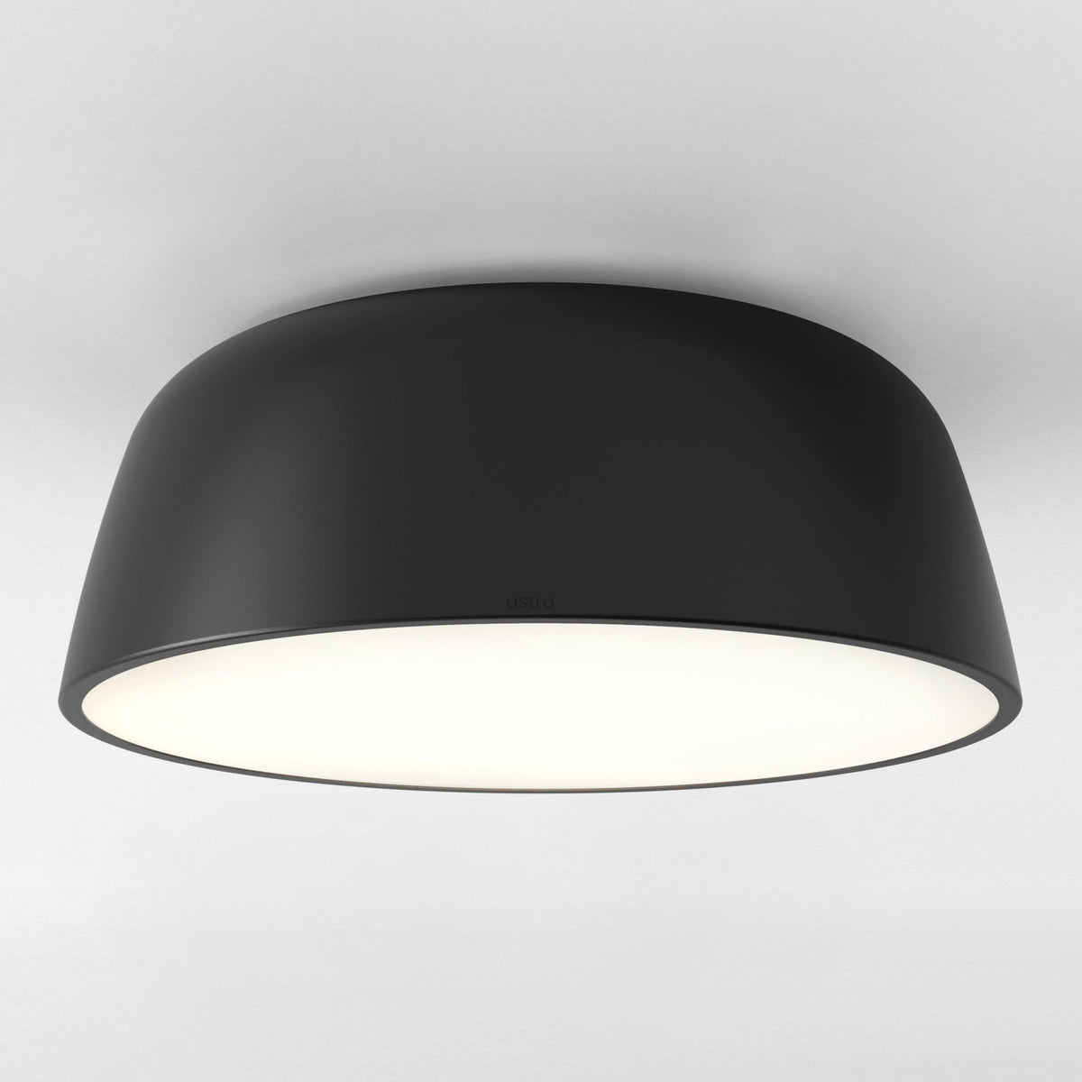 Astro ceiling light in black, with a white illuminated diffuser