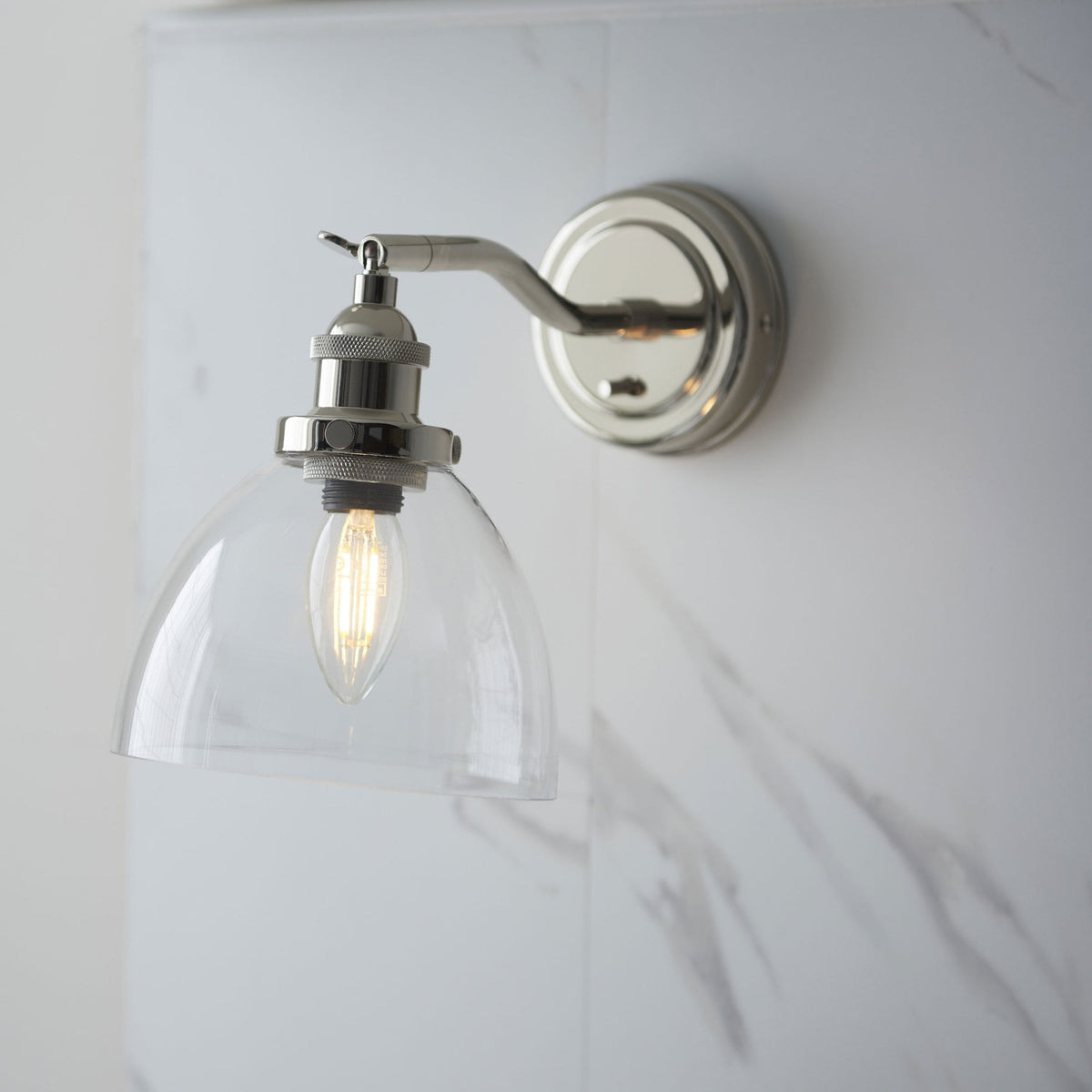 Hansen Switched Wall Light in a Bright Nickel Finish with Clear Glass