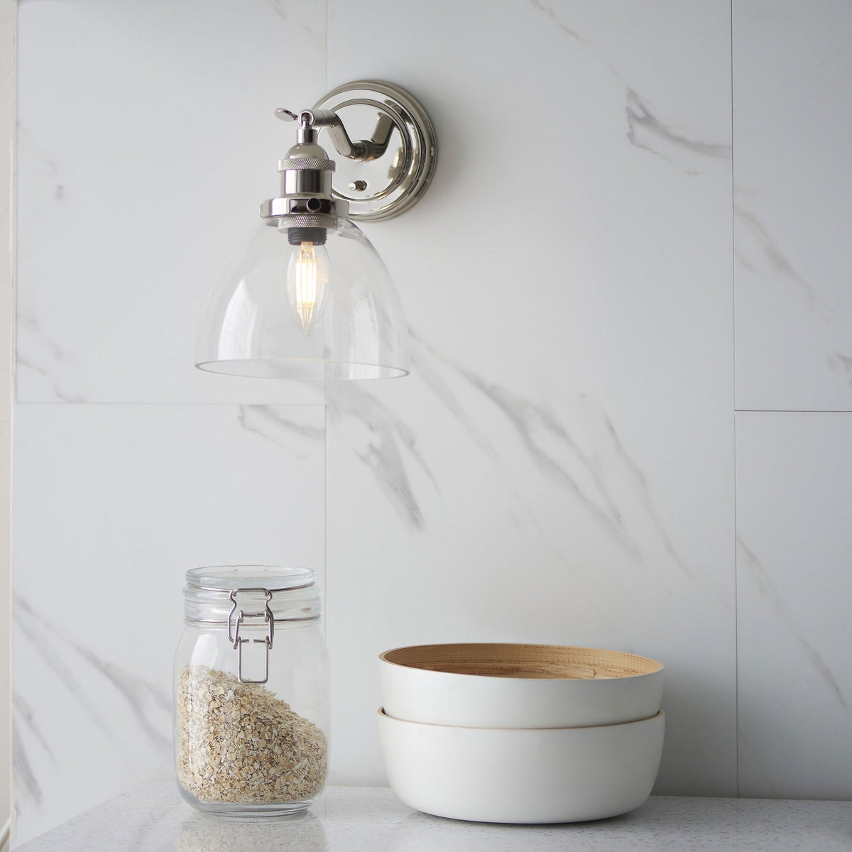 Hansen Switched Wall Light in a Bright Nickel Finish with Clear Glass