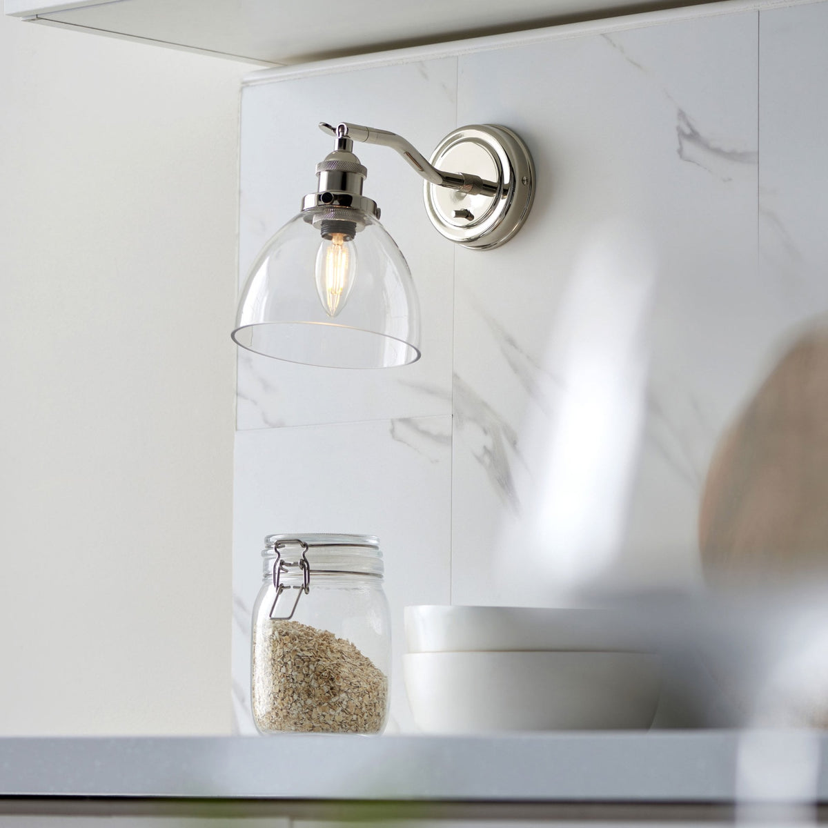 Hansen Switched Wall Light in a Bright Nickel Finish with Clear Glass