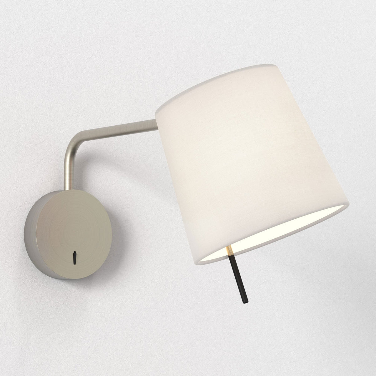 Brushed nickel wall sconce with a white conical shade and a black pull chain switch
